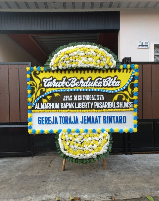 Papan Bunga Duka di Utama